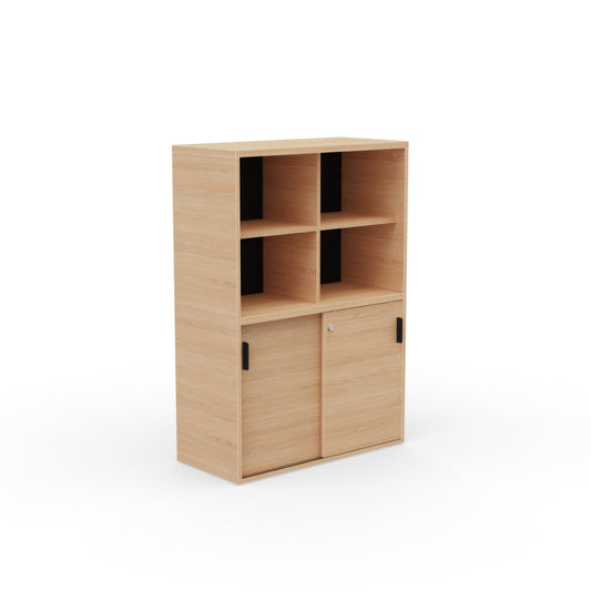 Kara Cupboard from EOL, measuring 144 cm tall, featuring two smooth sliding doors for concealed storage and integrated open shelving for display and easy access in the office natural oak corner view.