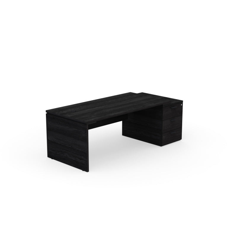 Kara Executive Desk from EOL featuring a large rectangular work surface with an integrated 3-drawer locking pedestal for secure filing and storage on the right side, ideal for a contemporary professional office. Black wood.